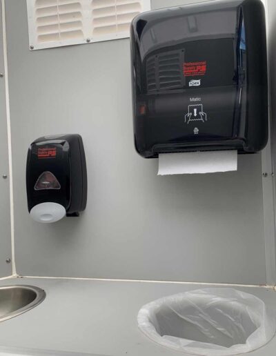 Our Crystal Concept Flushable Portable Restroom is also stocked with soap and paper towels.