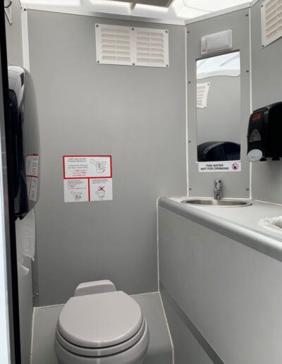 The inside of our Crystal Concept Flushable Portable Restroom.