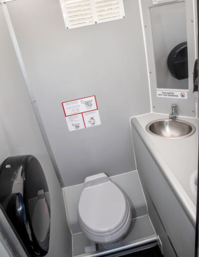 The inside of our Crystal Concept Flushable Portable Restroom.
