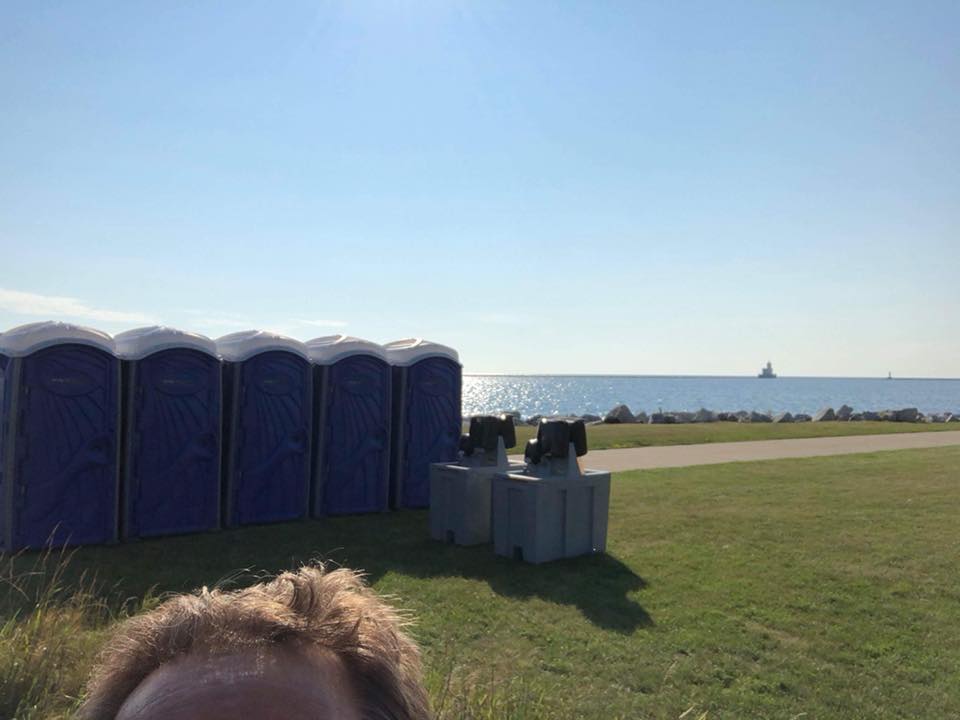 A forehead selfie in front of our Weekender Portable Restrooms and 2-Sided Hand Wash Stations by a lake. #ForeheadSelfie